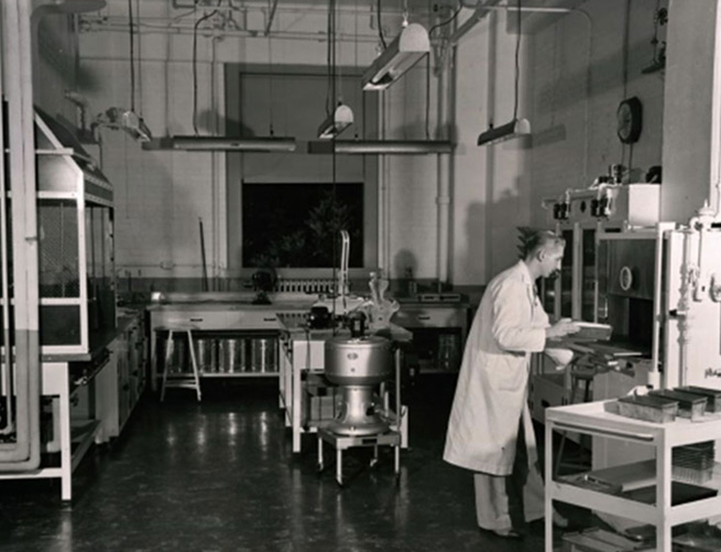 Laboratory in the past with the worker in white coat 